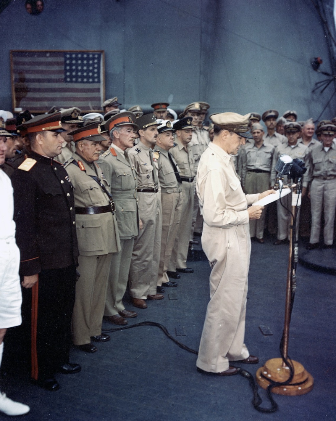 MacArthur at surrender ceremony. The flag flown by Perry is visible in the background. 